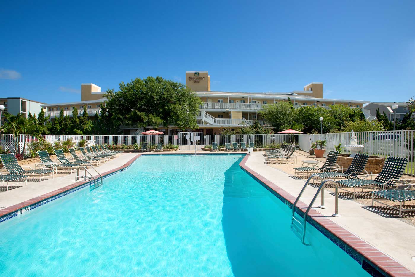 outdoor pool closeup with lounge chairs