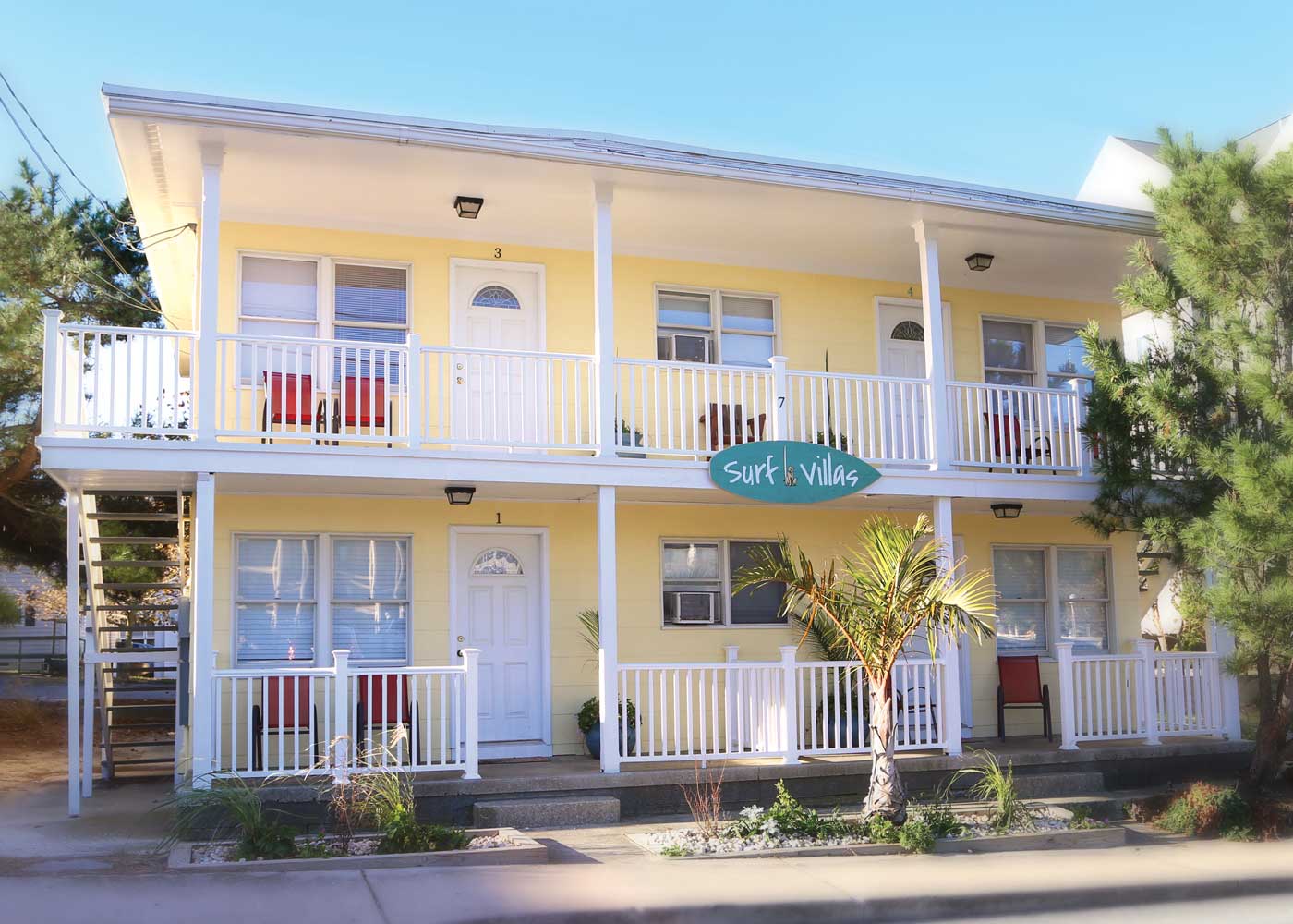 surf villas front porch with building sign